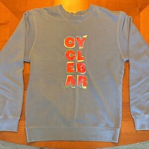 Blue Crewneck Sweater with vibrant multi-color CycleBar logo